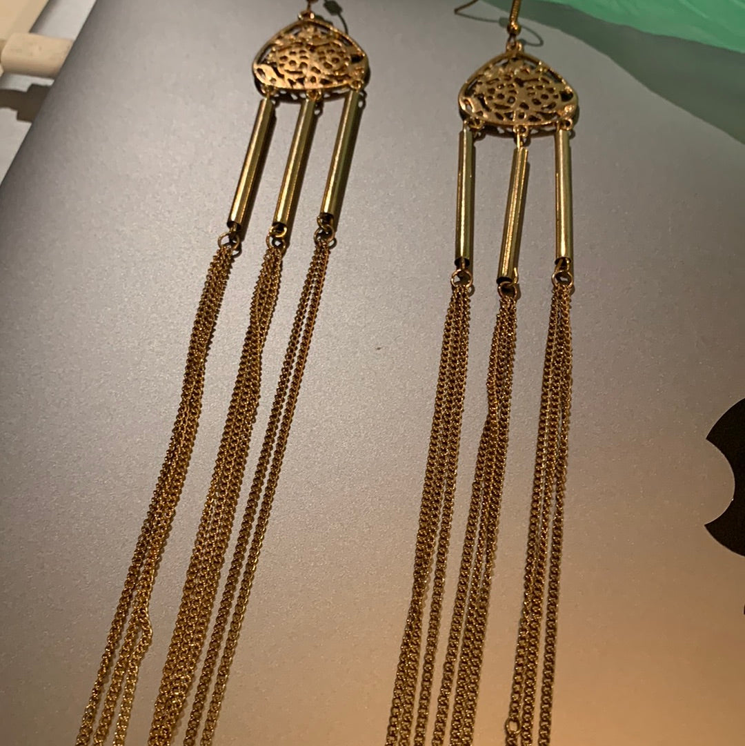 Very long golden earrings
