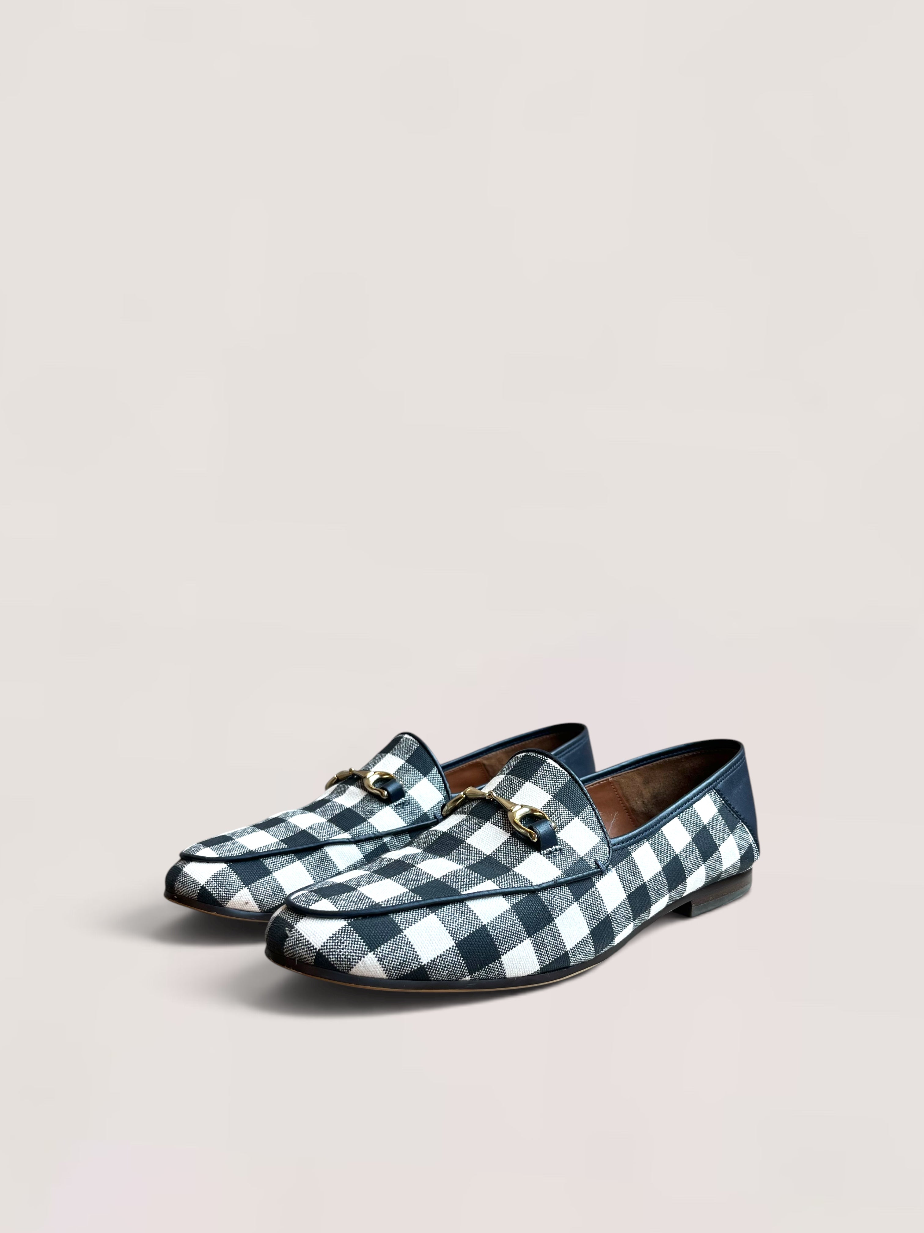 Black and white checked Coach loafers